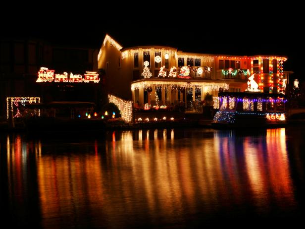 lakeside home and boat decked out in christmas lights lakeside home and boat decked out in christmas lights