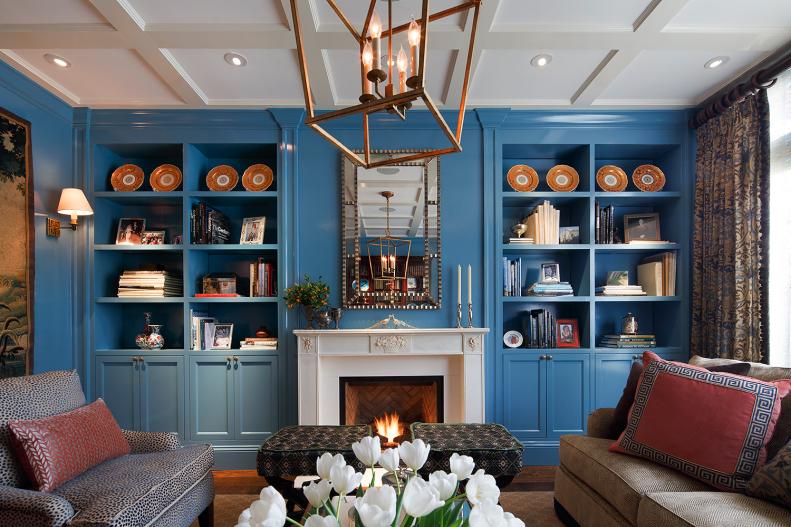 Blue Built-in Shelves & White Fireplace in Traditional Living Room
