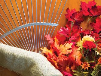 What you will need: medium rake head hack saw (optional) box saw artificial autumn leaves (2 bunches) artificial mums piece of burlap 4” wide by 45” long paint stir stick craft board (1/4” x 2 &frac12;” x 24”) craft paint 2 brads or small nails adhesive letters floral wire wire cutters