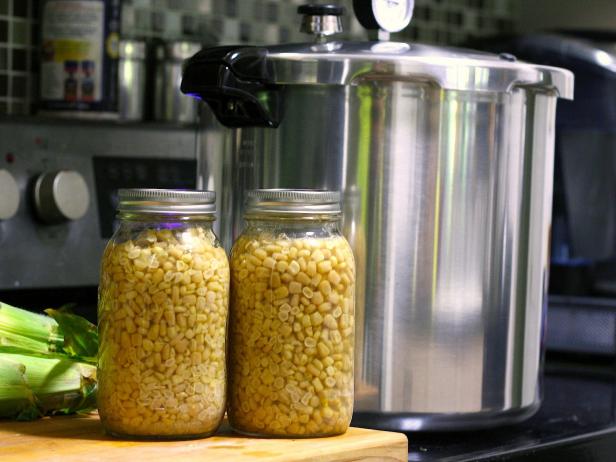 Pressure canners use steam to safely can low acid foods (like corn). Pressure canners use steam to safely can low acid foods (like corn).