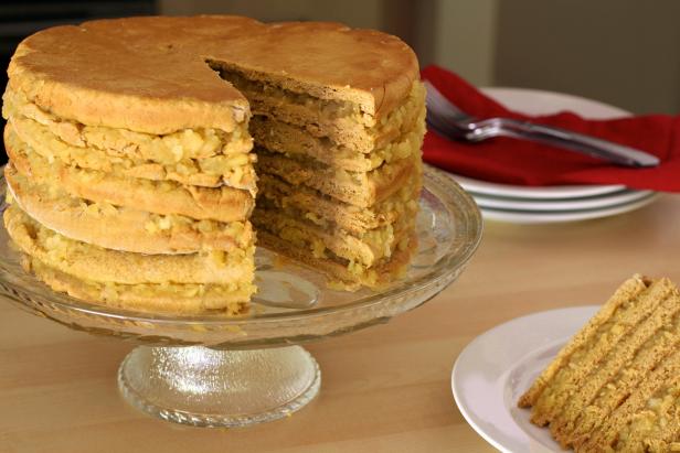 Stiff dough and sweet apple filling tower ever-higher when building an apple stack cake. Stiff dough and sweet apple filling tower ever-higher when building an apple stack cake.
