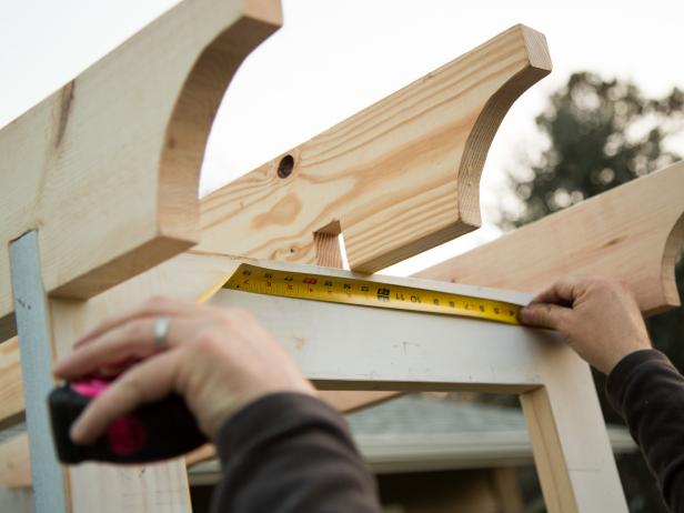 Once the outside pieces are secured into place, measure for the center, and install the third board.