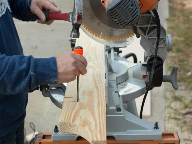 Use a wood chisel and hammer to remove the appropriate width necessary to accommodate the doors.