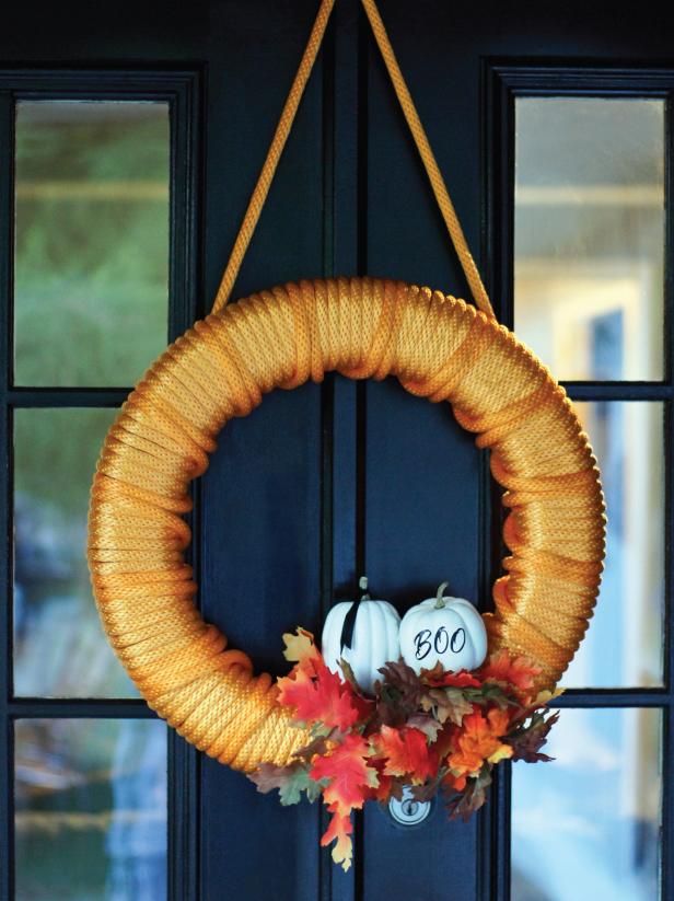 Hang your festive orange Halloween wreath with a built in hanger. Hang your festive orange Halloween wreath with a built in hanger.