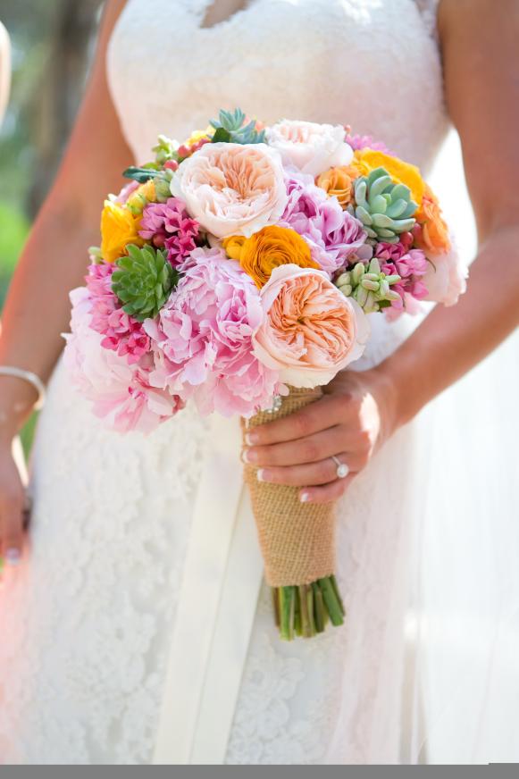 Ashley Elizabeth: Sarah Bernhardt peonies, yellow ranunculus, Juliet garden roses, hot pink bouvardia, garden rose Rene Goscinny, Blushing Romance hypericum berries, Mambo spray roses, small succulents, and the tops of tuberose for aroma. Ashley Elizabeth: Sarah Bernhardt peonies, yellow ranunculus, Juliet garden roses, hot pink bouvardia, garden rose Rene Goscinny, Blushing Romance hypericum berries, Mambo spray roses, small succulents, and the tops of tuberose for aroma.