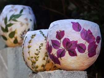 These pressed flower lanterns are the perfect addition to a warm summer’s eve. They are easy and cost almost nothing to make, plus you can use them to preserve your favorite summer flowers even after the blooms have passed. A warm, gentle glow makes these perfect for a backyard party, or a quiet evening alone under the stars.