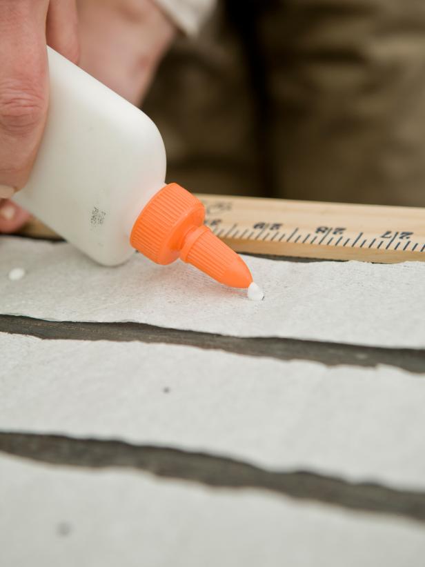 Dab a bit of water-soluble glue on each mark.