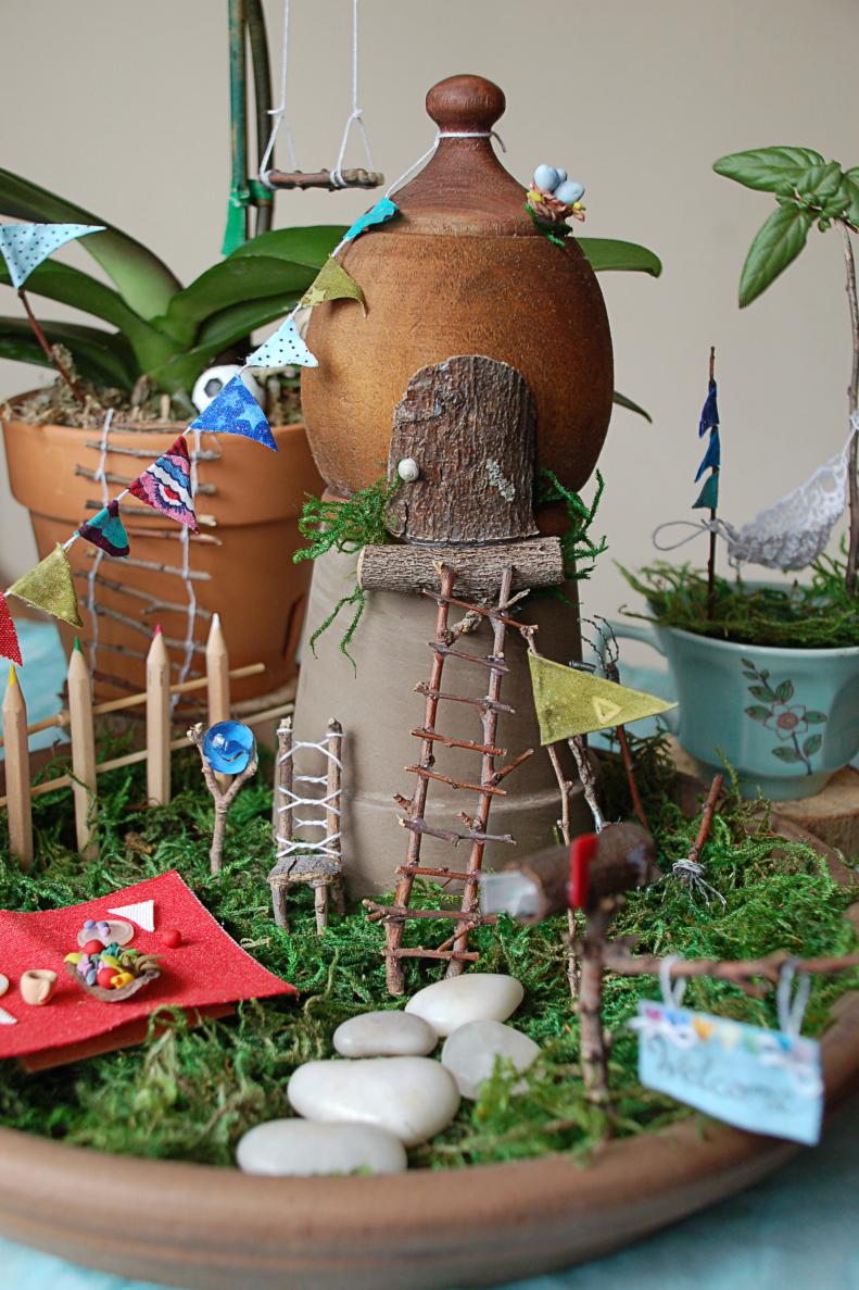 With a little hot glue, a few craft supplies and some potted plants, you can create a beautiful indoor fairy garden that's perfect for every season. Click through this gallery for fun ideas and inspiration to get started on your own fairy garden.