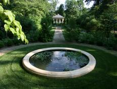 Circular Reflecting Pool Surrounded by Manicured Lawn