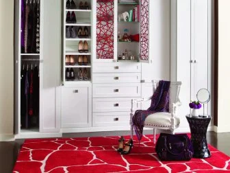 Everything about this system is stylish and easy to locate, which makes getting ready a breeze. The artistic cabinetry created by California Closets features adjustable glass shelving to store a variety of accessories, perfumes and purses.