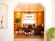 Arched door entryway leading to dining room area. 