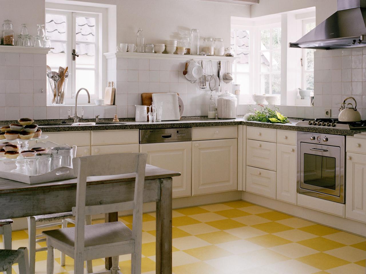 easy to install sunny yellow linoleum squares imbue the kitchen with cheer the surface locks