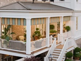 Traditional Porch With White Railings and Columns