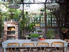 Rustic Industrial Outdoor Dining Room With Brick Pizza Oven