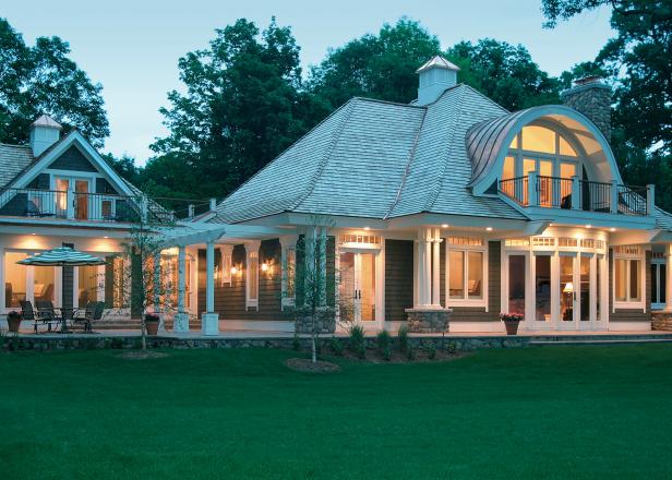 Exterior of House Warmly Lit by Indoor Outdoor Lighting