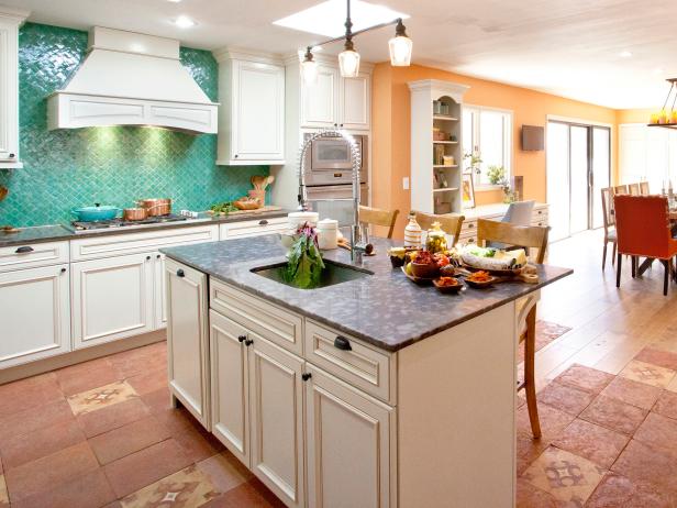 In order to add a stove, cabinets and appliances in the kitchen. the french doors had to be removed and a wall need to be added. Because valuable light was being taken away, the Kitchen Cousins added two skylights into the ceiling. After tearing the dining room wall down, and turning the dining room into the kitchen, there is a whole new flow and life to the atmosphere and energy of the kitchen and dining room area. What once was a cold empty ding room is now a large kitchen that opens to a large dining room.
As seen on HGTV's the Kitchen Cousins.