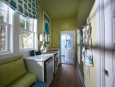 Both stylish and designed to make light work of large wash loads, the laundry room hints at color palette and Hollywood regency design style.