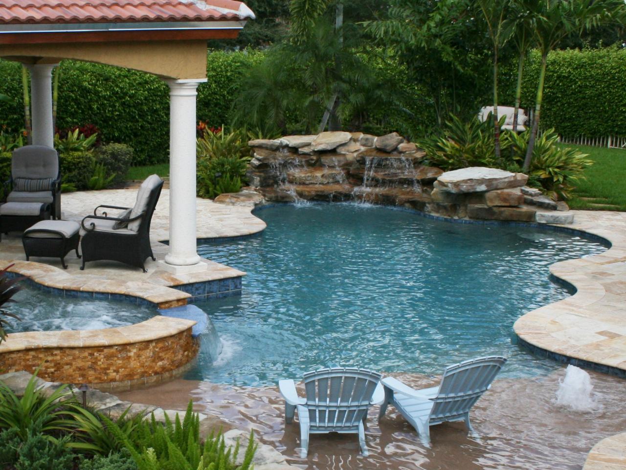 Waterfall Swimming Pool Designs a 20 foot high cascading waterfall with a two sided spillway drops into swimming pool designsswimming Cascading Waterfalls Waterfall Swimming Pool Designs how to build a pool waterfall Cascading Waterfalls