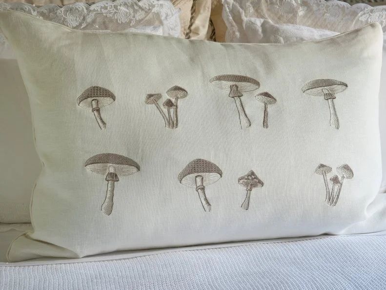 This statement making Yves Delorme pillow with metallic threads is patterned with various mushroom shapes. Photo By: Dan Piassick