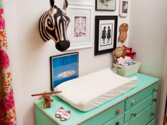 Nursery With Eclectic Gallery Wall and Mint Green Changing Table