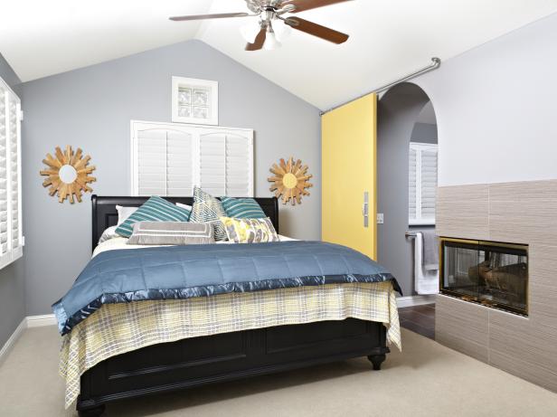 Guest Bedroom With Sliding Barn Door and Vaulted Ceiling