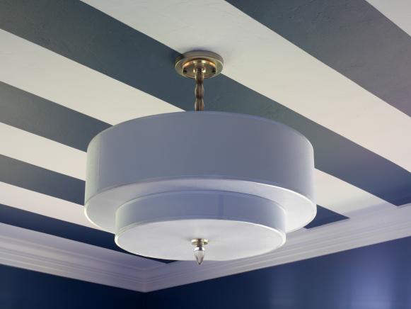 Once the junction box was installed and all dust was removed, Jason had his contractor install a fabric-covered pendant that adds diffused light to the space, making it more functional for Dylan at night.