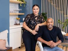 As seen on HGTV's Married to Real Estate, hosts Egypt Sherrod and Mike Jackson pose in the newly renovated living room in the basement of the Weaver's home. (Portrait)
