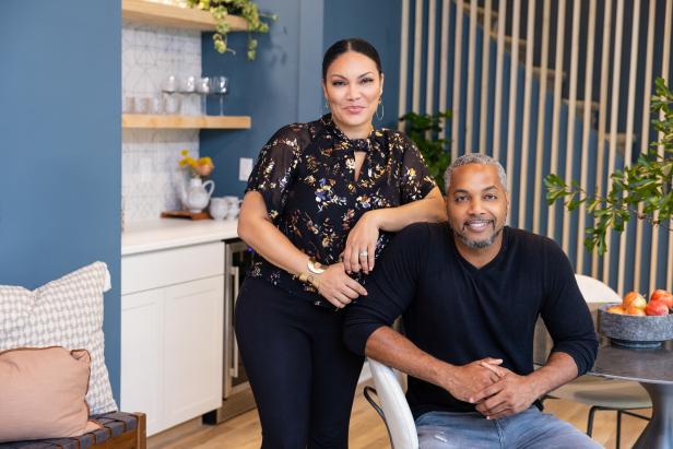 As seen on HGTV's Married to Real Estate, hosts Egypt Sherrod and Mike Jackson pose in the newly renovated living room in the basement of the Weaver's home. (Portrait)