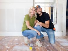 Jenny (L) and Dave (R) Marrs kneel and hold hands in the master bedroom of the home they are remodeling to be a bed and breakfast. Sheetrock dust covers the floor. This home was built in the 1880's and is located in Rogers Arkansas close to downtown and can be seen on Fixer to Fabulous on HGTV.