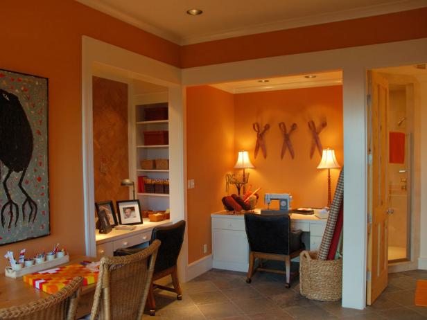 Eclectic Orange Crafts Room With Vibrant Artwork Eclectic Orange Crafts Room With Vibrant Artwork