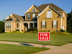 Home Exterior With "For Sale" Sign