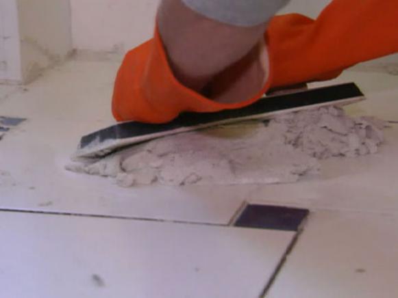 Spread grout after the tile sets.