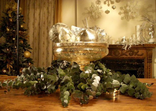 Serving dish with silver ornaments and greenery