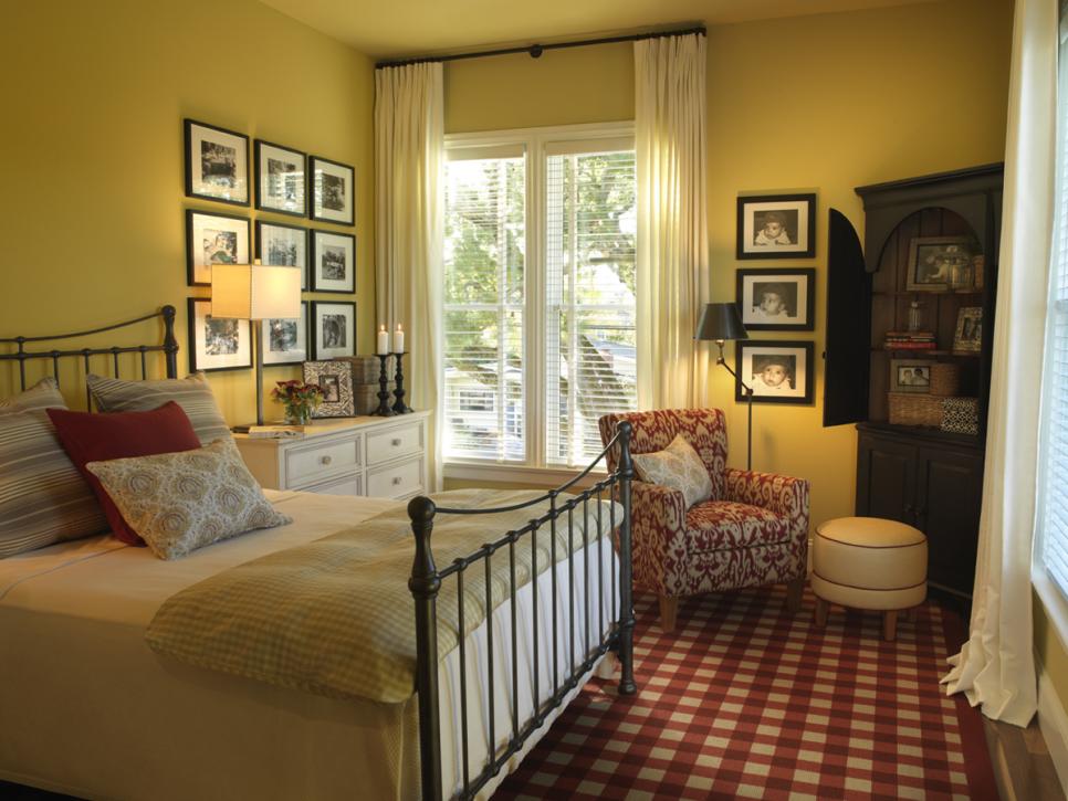 Yellow Bedroom With Check Carpet, Framed Photo Art and Patterned Chair