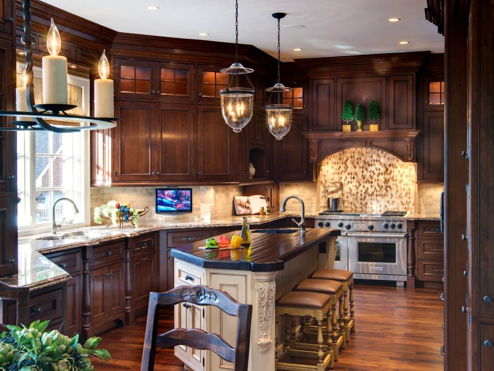 Brown Kitchen With White Island, Pendant Lights and Beige Stools