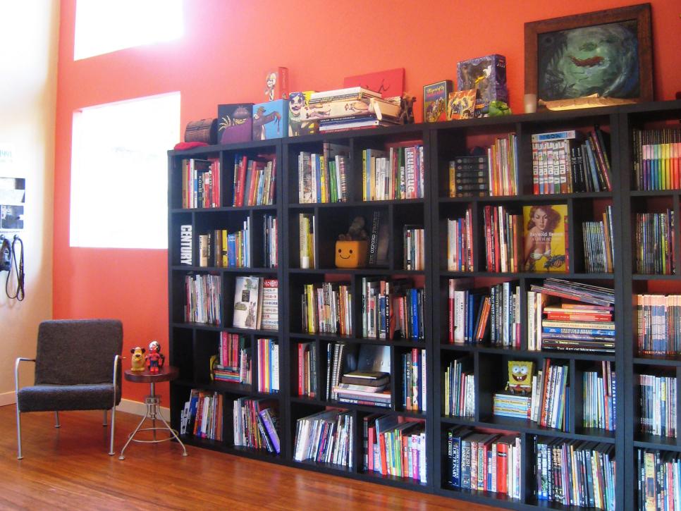 Eclectic Orange Home Office With Bookshelves