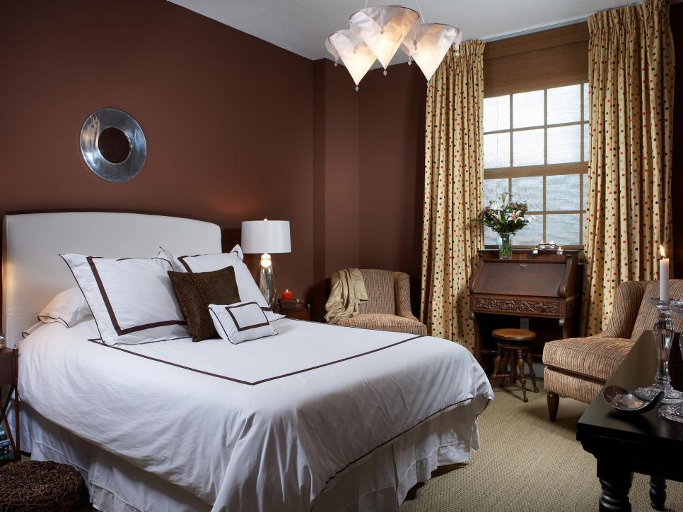 Brown Transitional Bedroom With White and Cream Furnishings