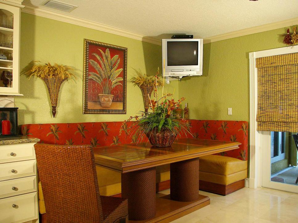 Green Tropical Dining Area With Red Accents