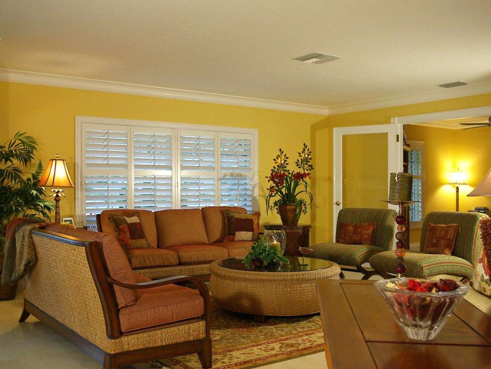 Yellow Living Room With Woven Sofa Backs and Round, Woven Coffee Table