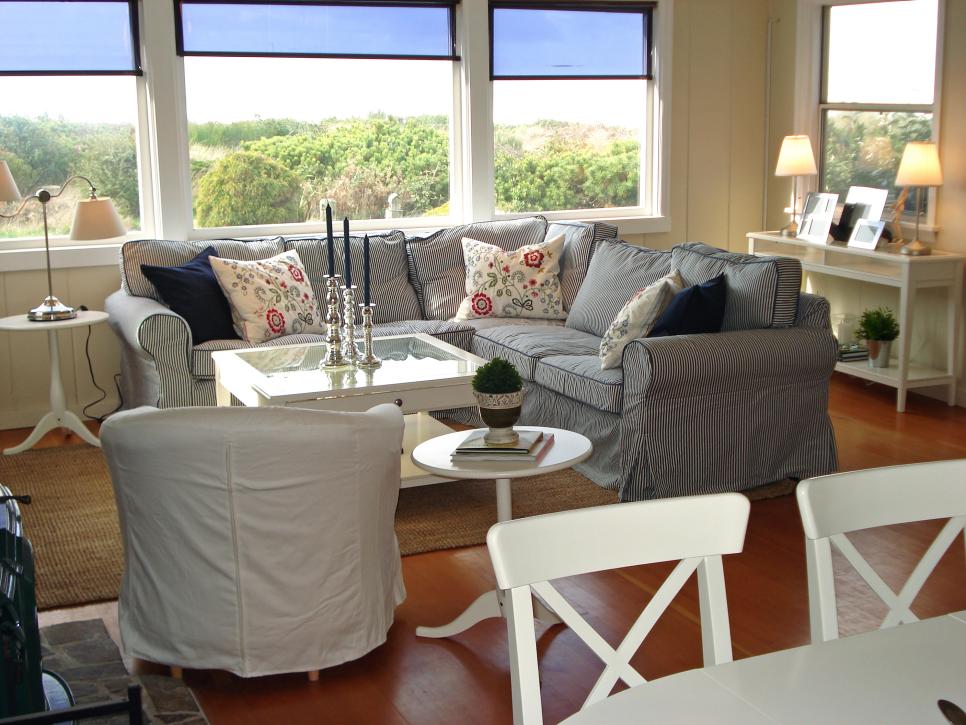 Beach Cottage Living Room With Wood Floor, Large Windows & Ocean View