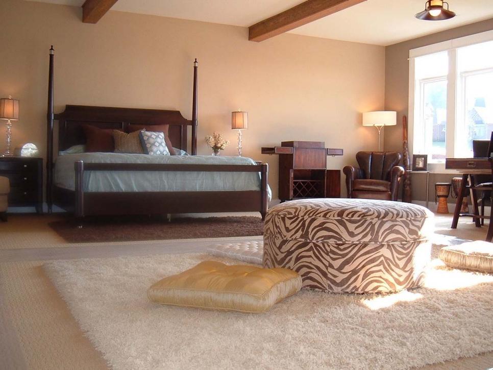 Neutral Bedroom With Two-Poster Bed & Zebra Ottoman