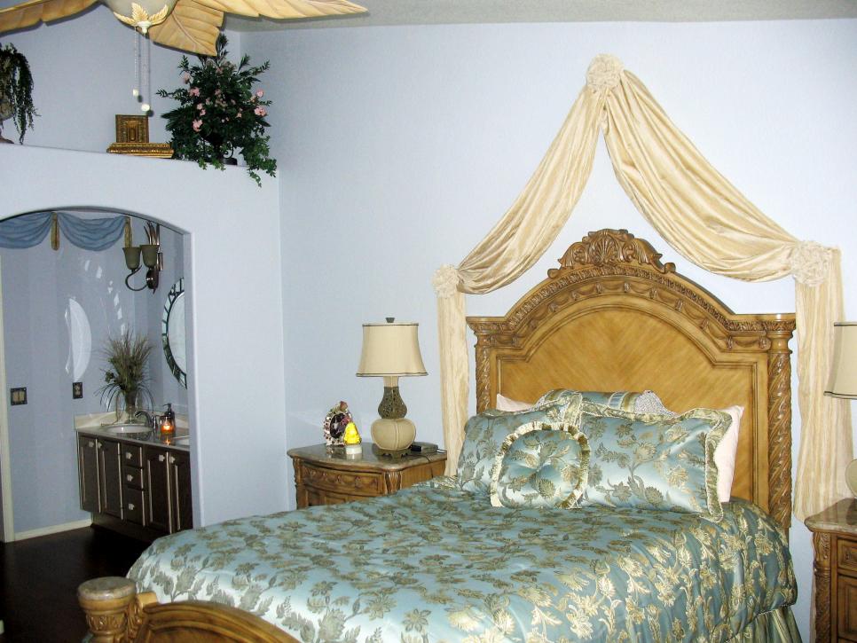 Blue Bedroom With Carved Headboard and En Suite Bathroom
