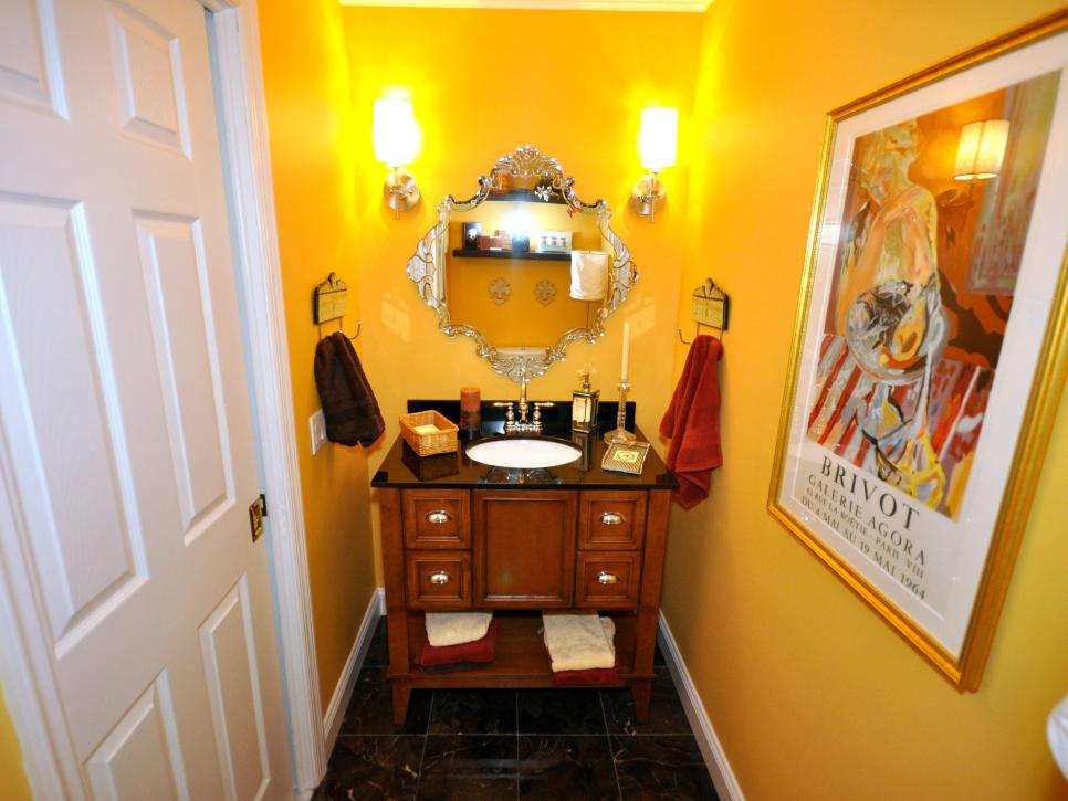 Bright Yellow Bathroom With Black Tile Flooring