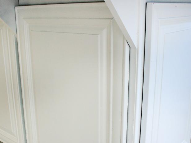 A kitchen cabinet door front with primer paint applied. 