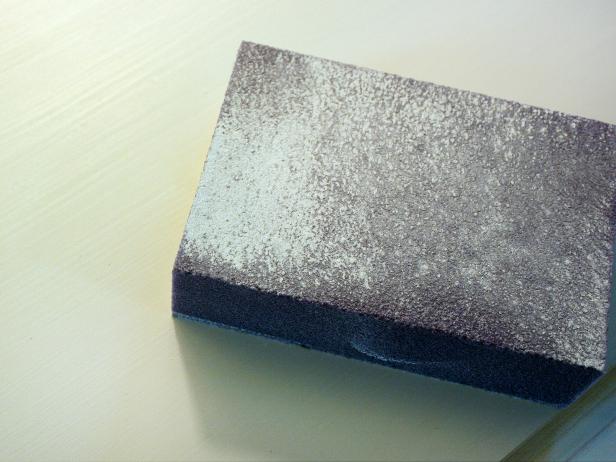 Gray Sanding Pad With White Dust