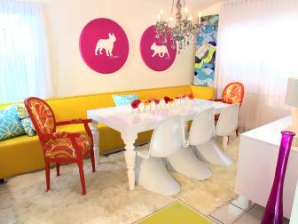 White Dining Room With Bright Yellow Sofa and Hot Pink Art