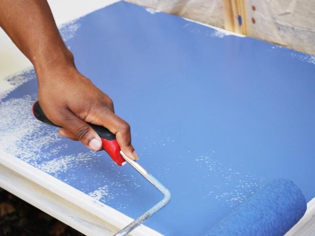 Use a paint roller to apply two even coats of paint to your table. Let it dry. Replace the paint pan with a new liner, then pour floor sealer into the new liner. Use a paint roller to apply a single coat. Tip: Keep the paint brush nearby to brush out any air bubbles.