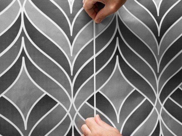 Using seam roller on wallpaper.