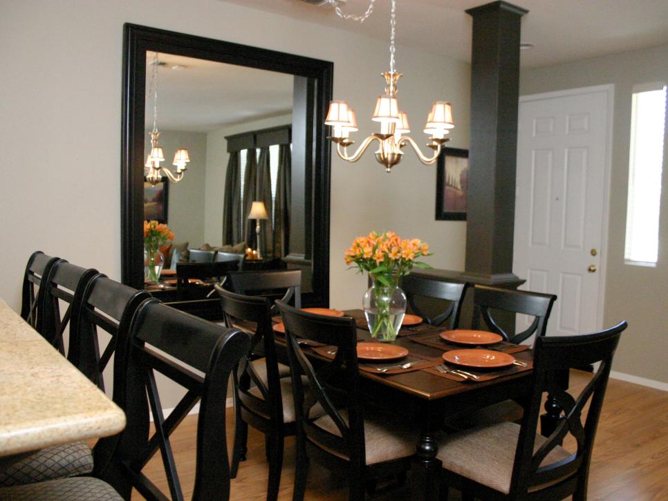 Dining Room With Chandelier and Large Mirror