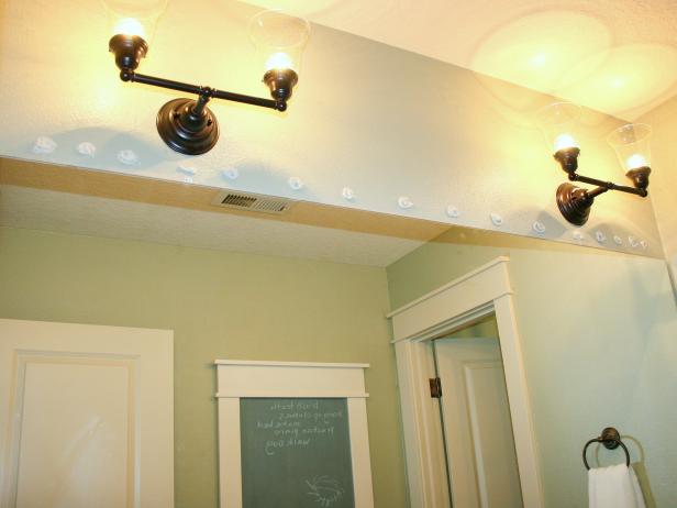 Dots of Glue Above Wall Mirror in Bathroom